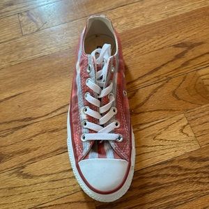 Red and white stripped converse sneakers